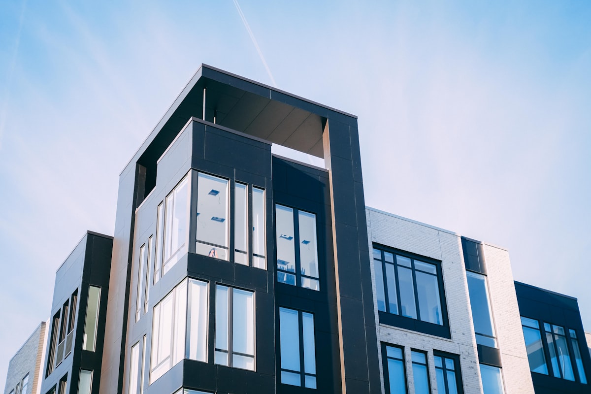 Modern gray concrete building facade under blue sky in Argentina